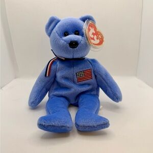 Ty Beanie Baby “America” 🇺🇸 Blue Bear w/ Flag – w/ Tag Protector